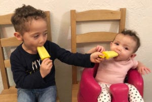 Easton (3 years) and Emmalee (6 months) enjoying frozen mango, ginger and coconut treats.