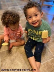Easton and Emmalee enjoying orange creamsicles.