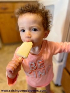 Emmalee enjoying her orange creamsicle.