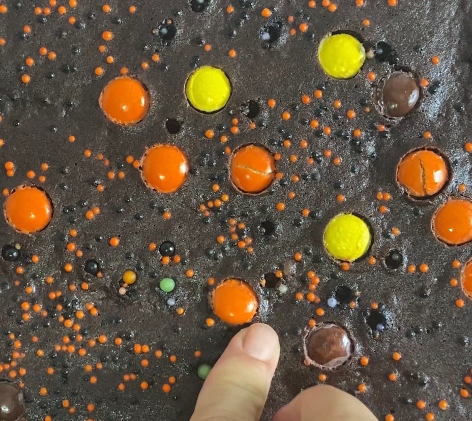 adding sprinkles once the brownie brittle came out of the oven