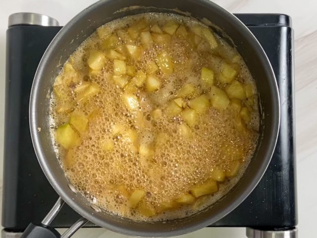Making apple syrup for apple mochi waffle.