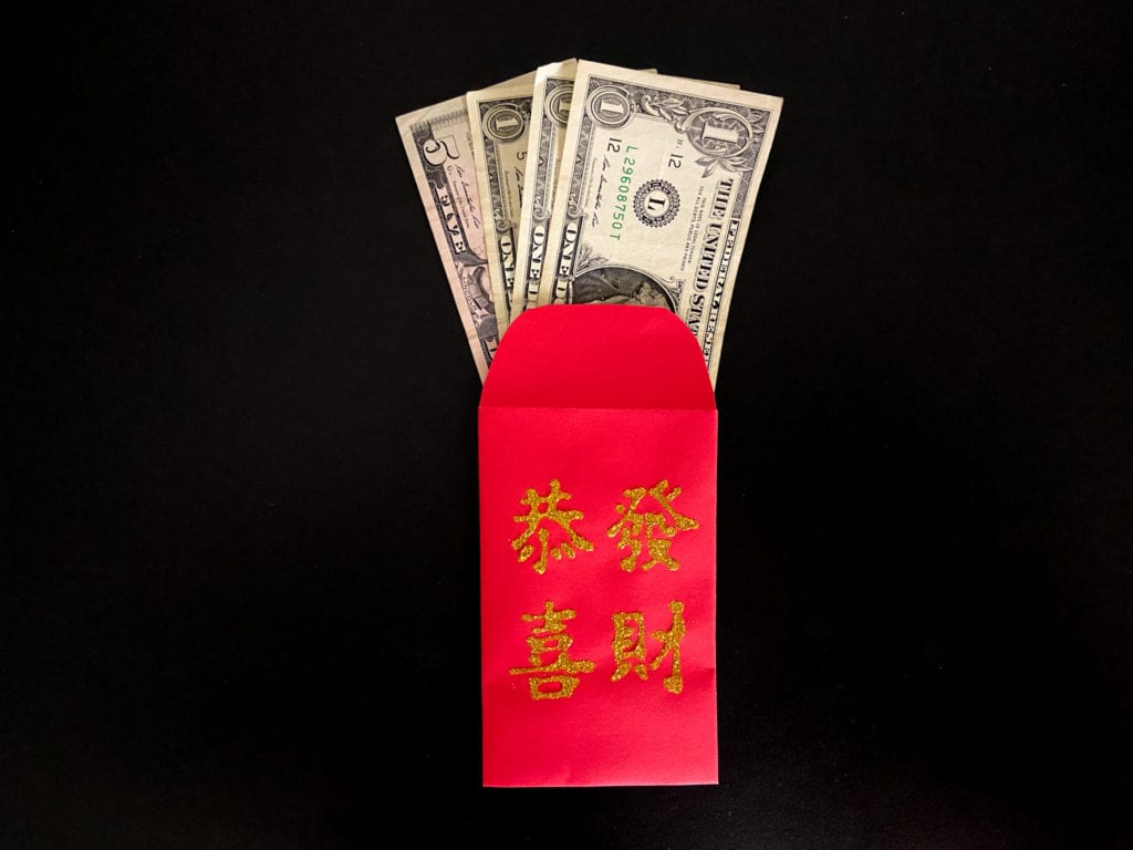 Chinese Red Envelope With Chinese Money Stock Photo, Picture and