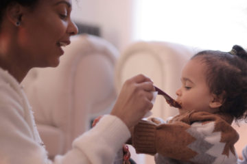 mom feeding baby