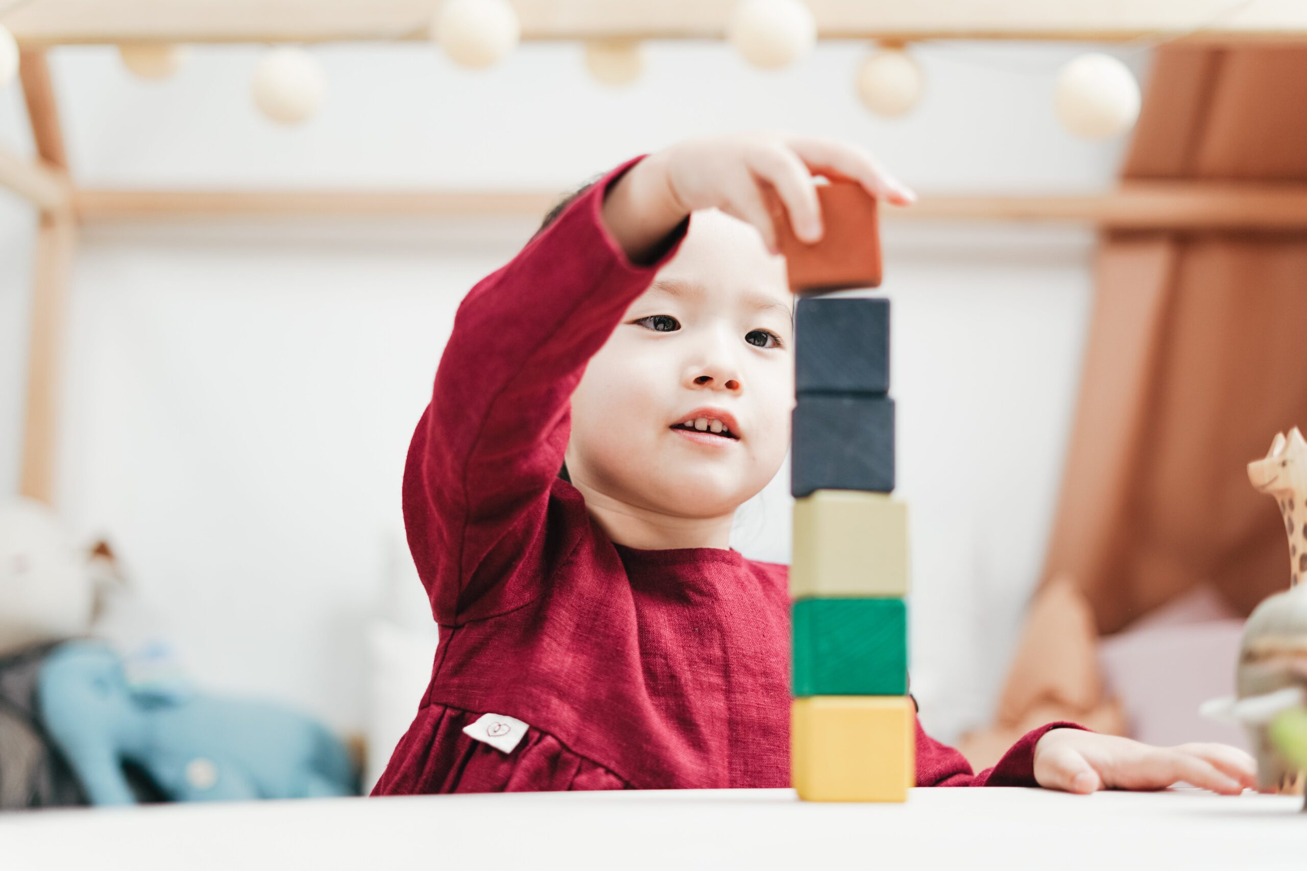 kid building with blocks