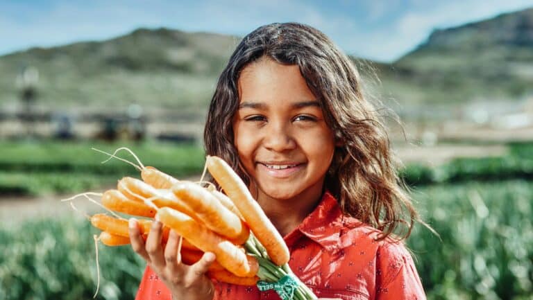Girl with carrots.