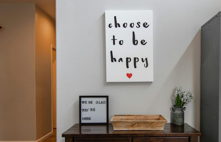 Modern interior design featuring motivational quote, wooden desk, and lockers.