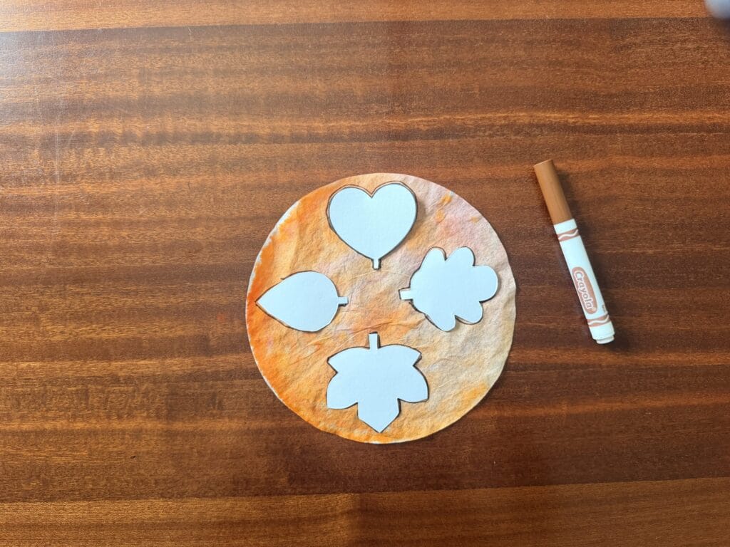 Cut out paper leaves on coffee filter