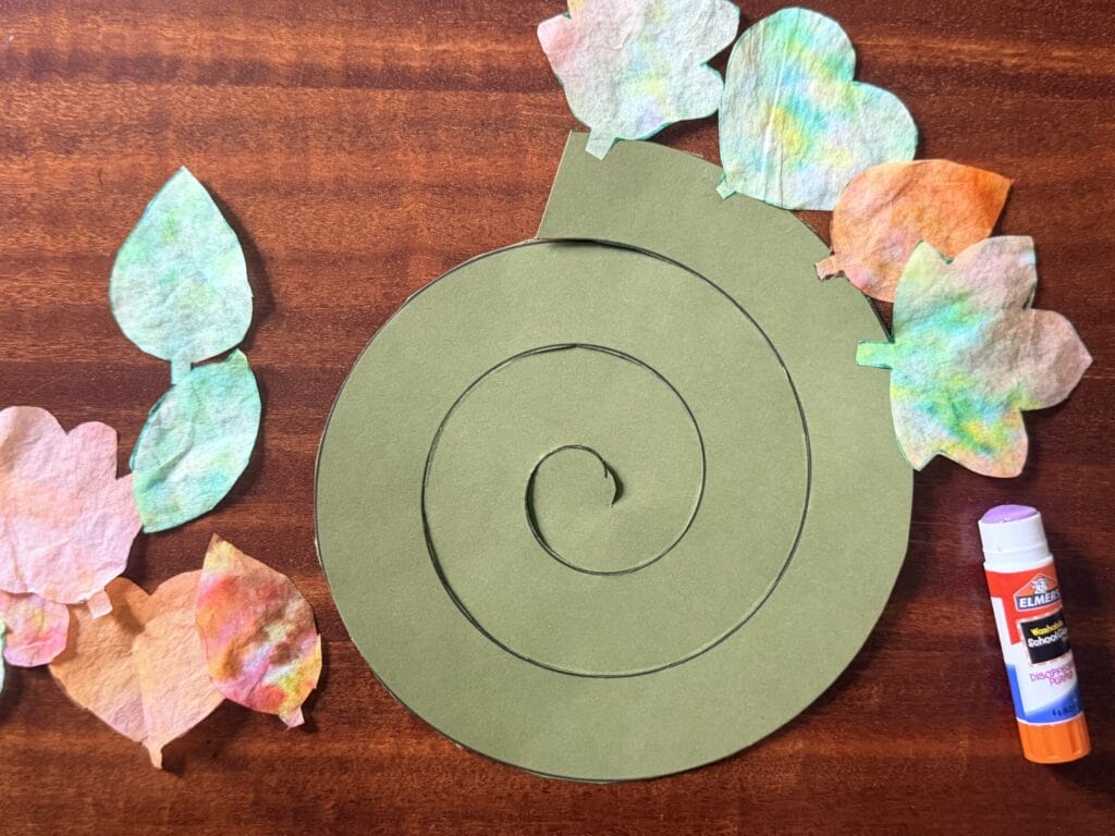paper spinner with coffee filter leaves glued onto it