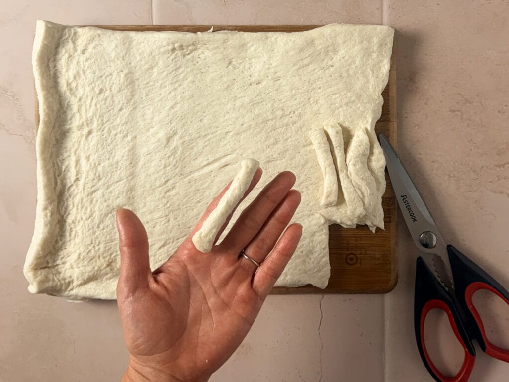 Refrigerated pizza dough cut into thin strips to make Halloween finger breadsticks.