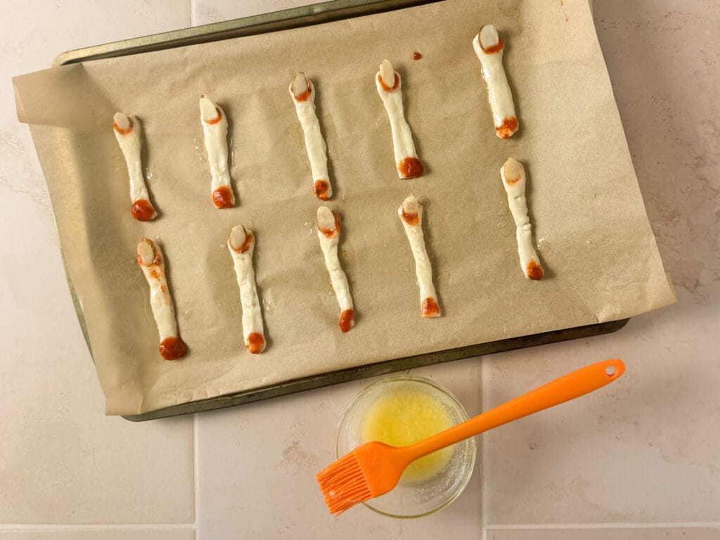 Halloween finger breadsticks brushed with melted garlic butter before baking.