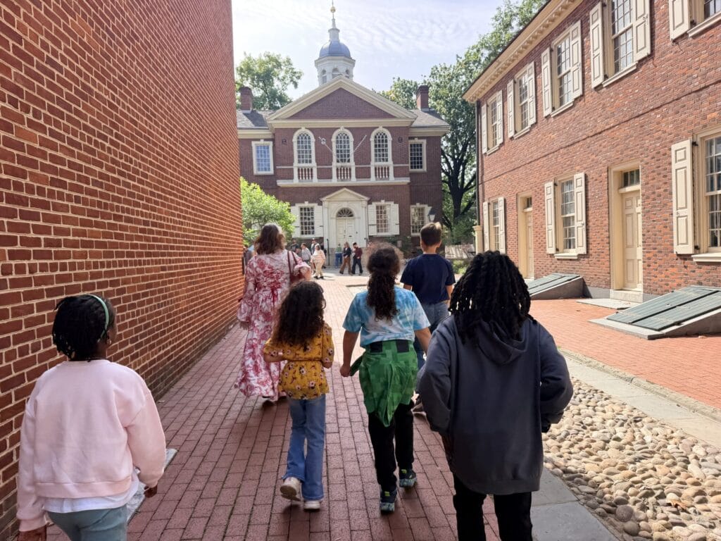 Kids walking down alley in Philly