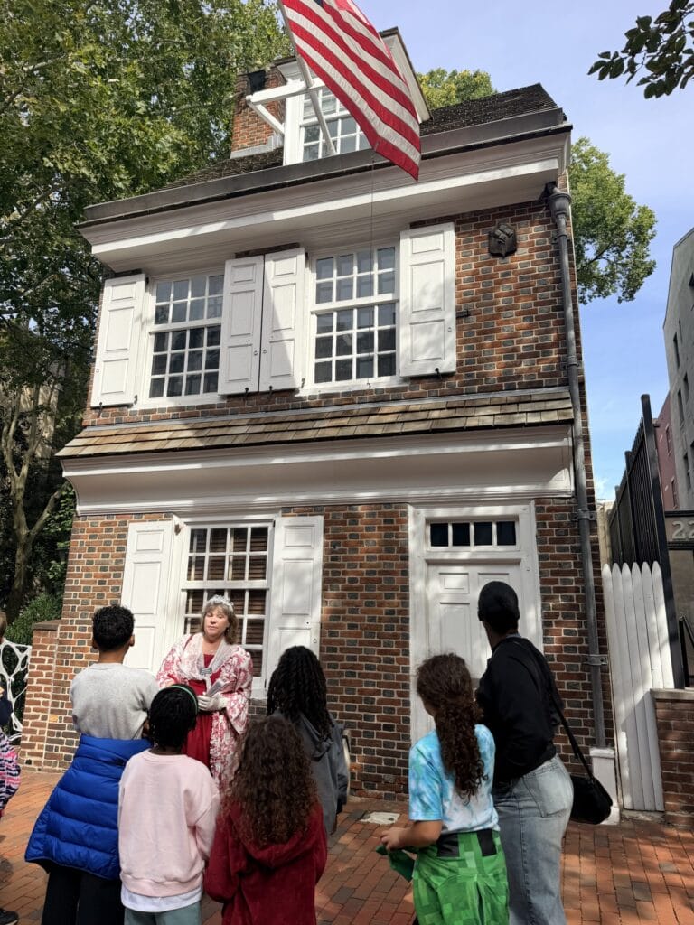 Kids on tour in front of Betsy Ross house